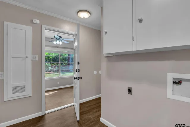 a view of room with window and hallway