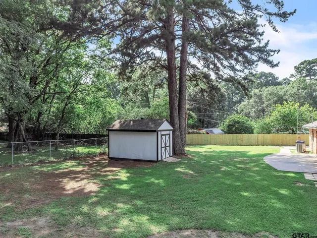 a backyard of a house with lots of green space