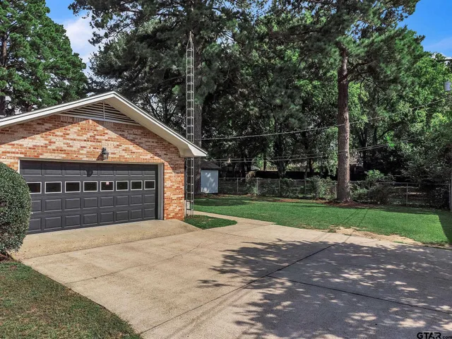 a view of house with yard and outdoor space