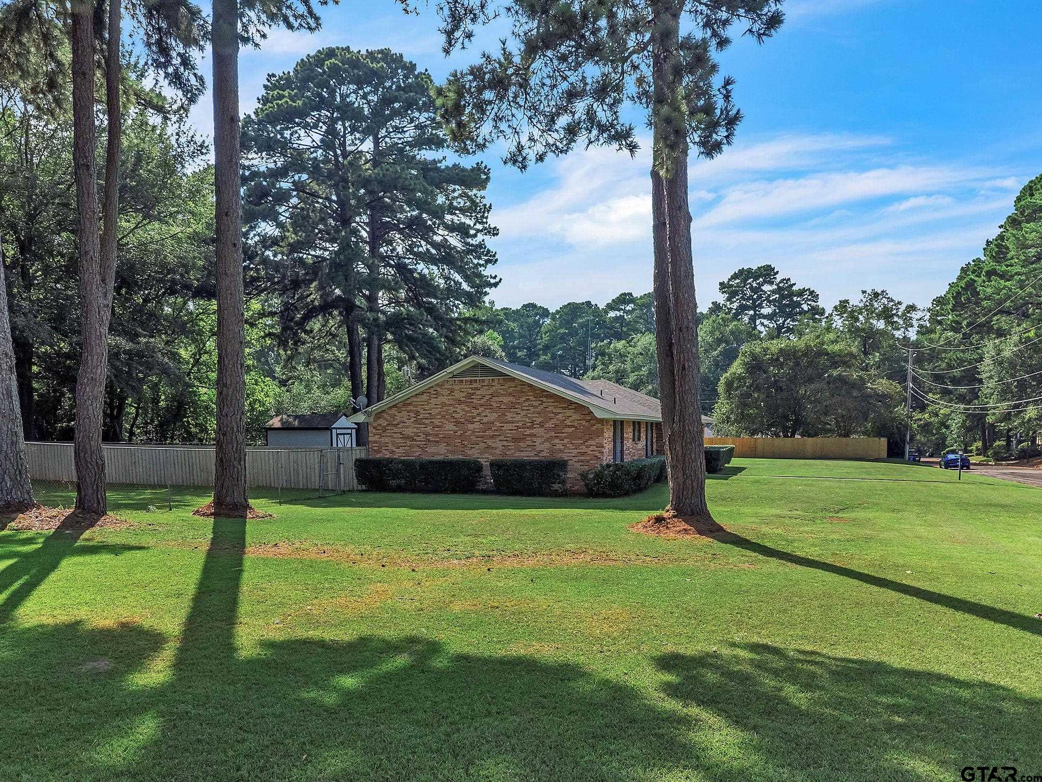 700 Emily Drive Longview, TX 75601 - Photo 43 of 45 a backyard of a house with lots of green space