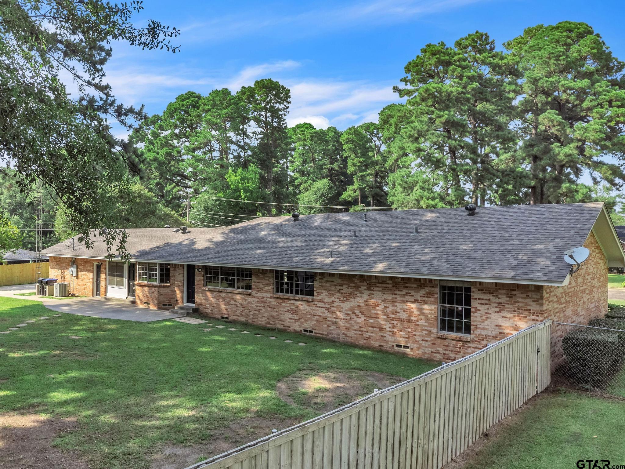 700 Emily Drive Longview, TX 75601 - Photo 44 of 45 an aerial view of a house with swimming pool and garden