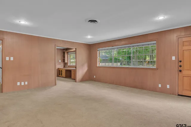 a view of an empty room with a window