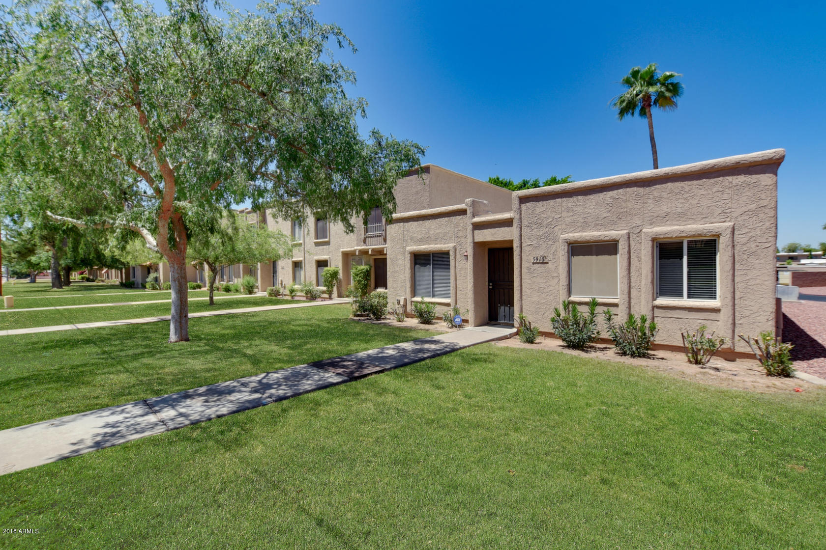 5910 North Granite Reef Road Scottsdale, AZ 85250 - Photo 1 of 33 a front view of house with a garden and patio