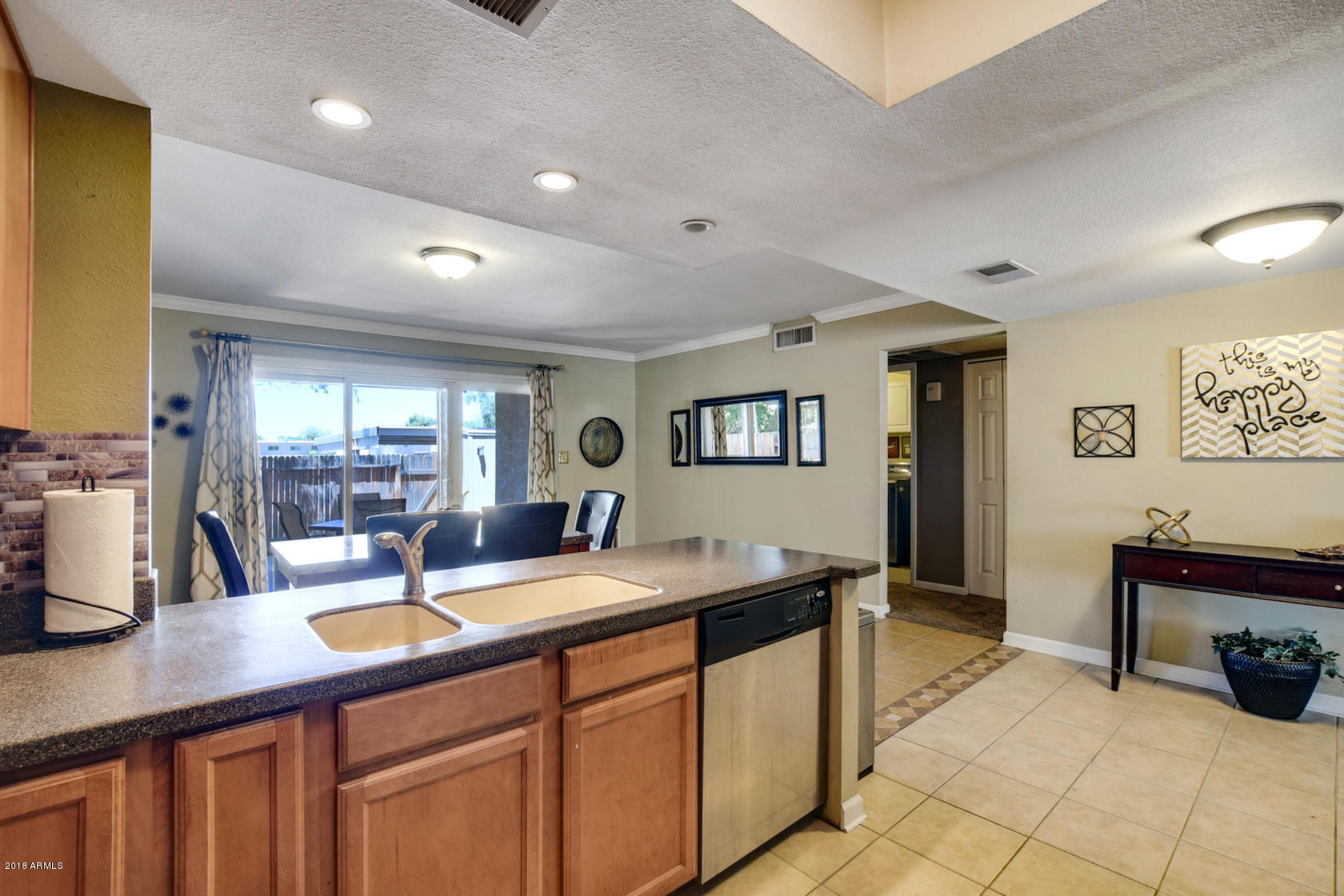 5910 North Granite Reef Road Scottsdale, AZ 85250 - Photo 13 of 33 a kitchen with a sink and cabinets