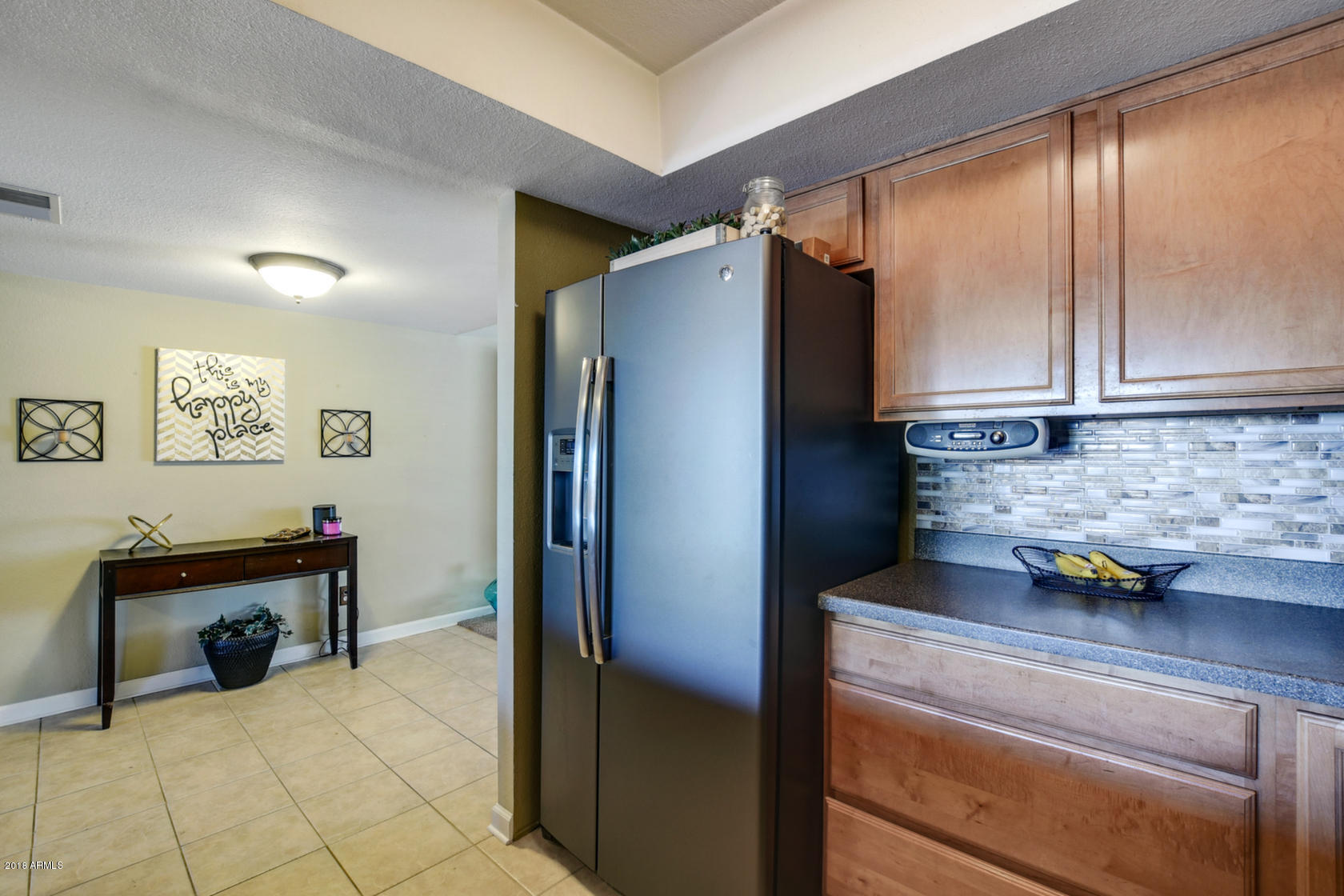 5910 North Granite Reef Road Scottsdale, AZ 85250 - Photo 14 of 33 a kitchen with a refrigerator and a sink