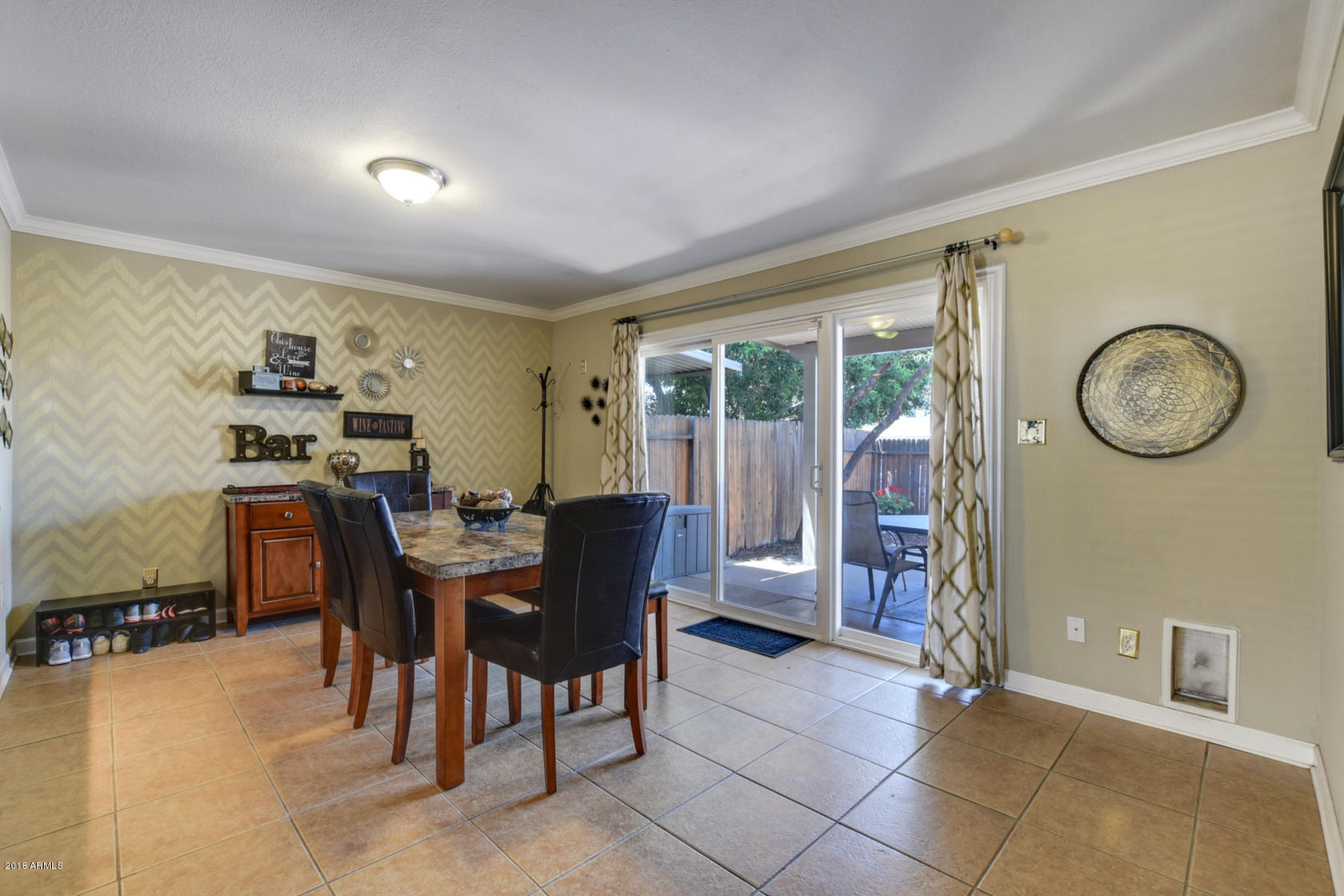 5910 North Granite Reef Road Scottsdale, AZ 85250 - Photo 15 of 33 a view of a dining room with furniture and a large window