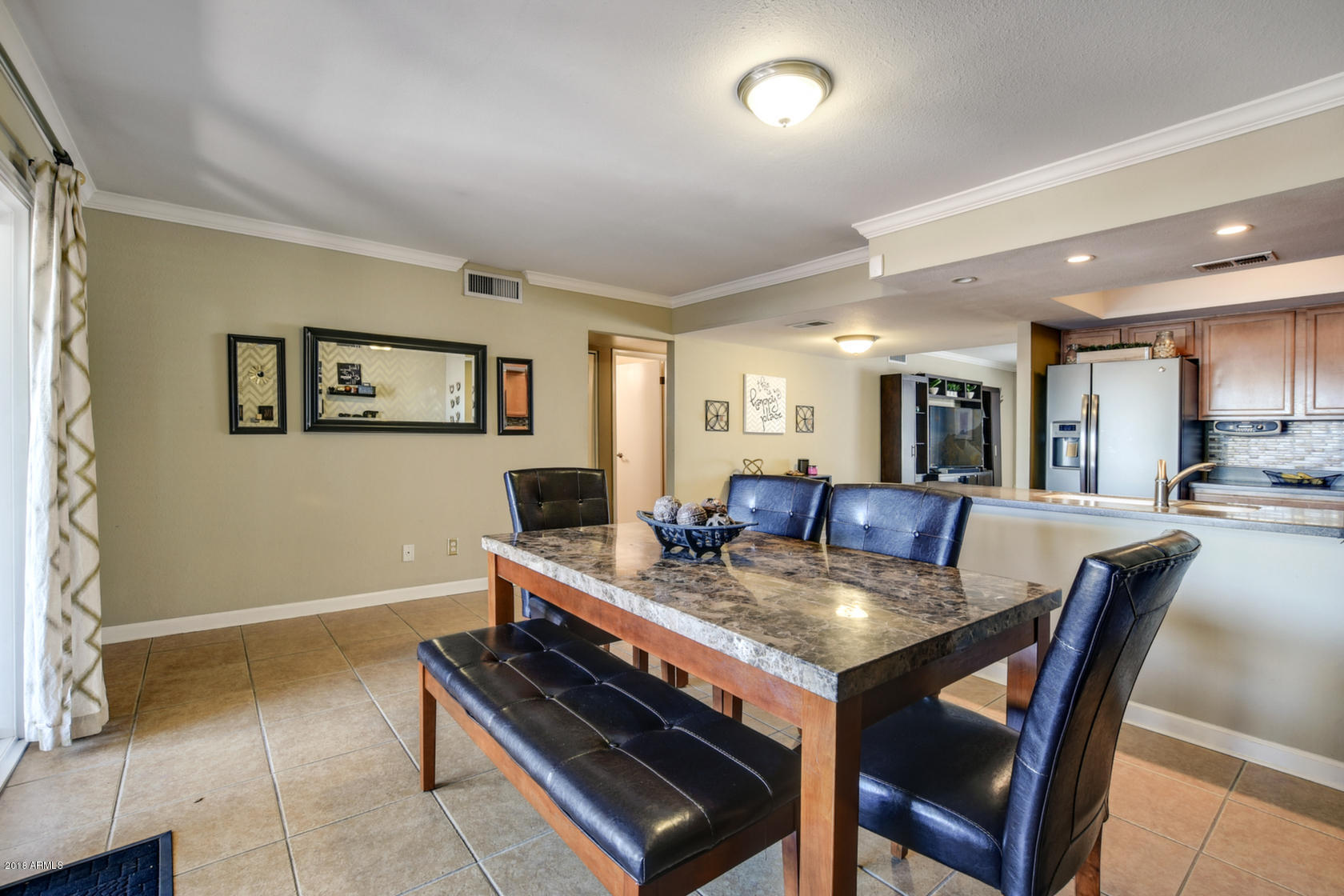 5910 North Granite Reef Road Scottsdale, AZ 85250 - Photo 16 of 33 a view of a dining room with furniture