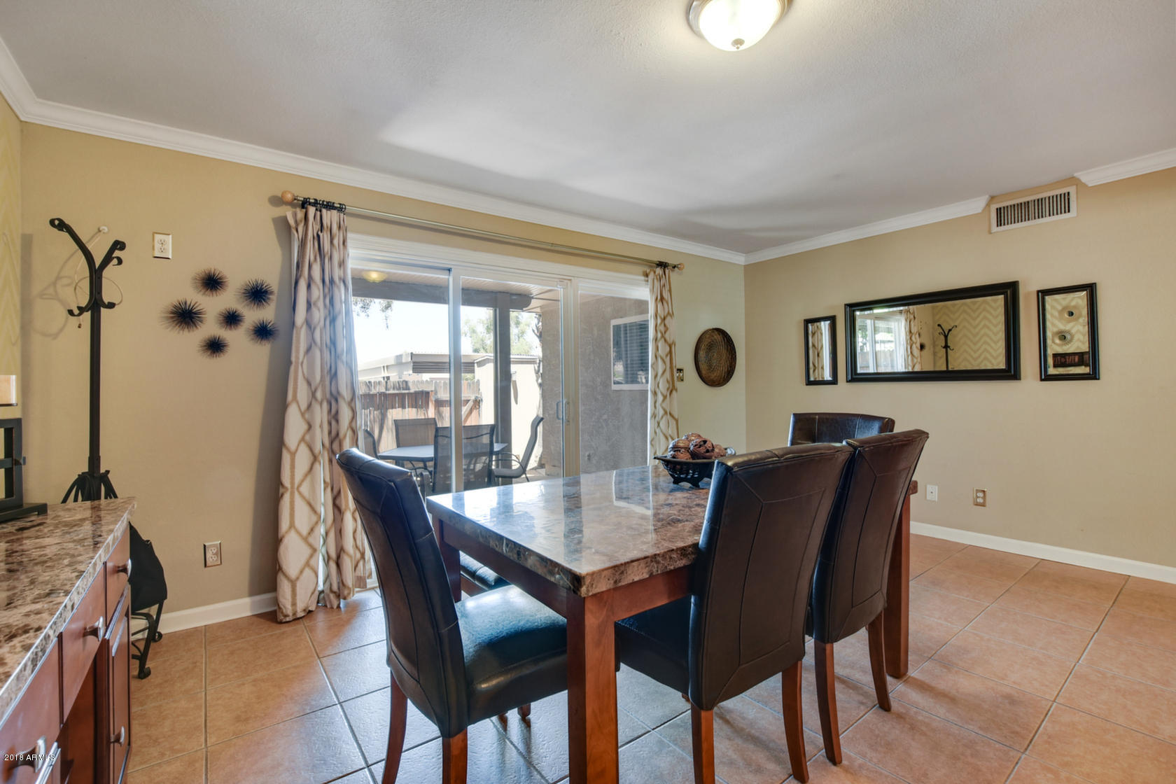 5910 North Granite Reef Road Scottsdale, AZ 85250 - Photo 17 of 33 a dining room with furniture and window