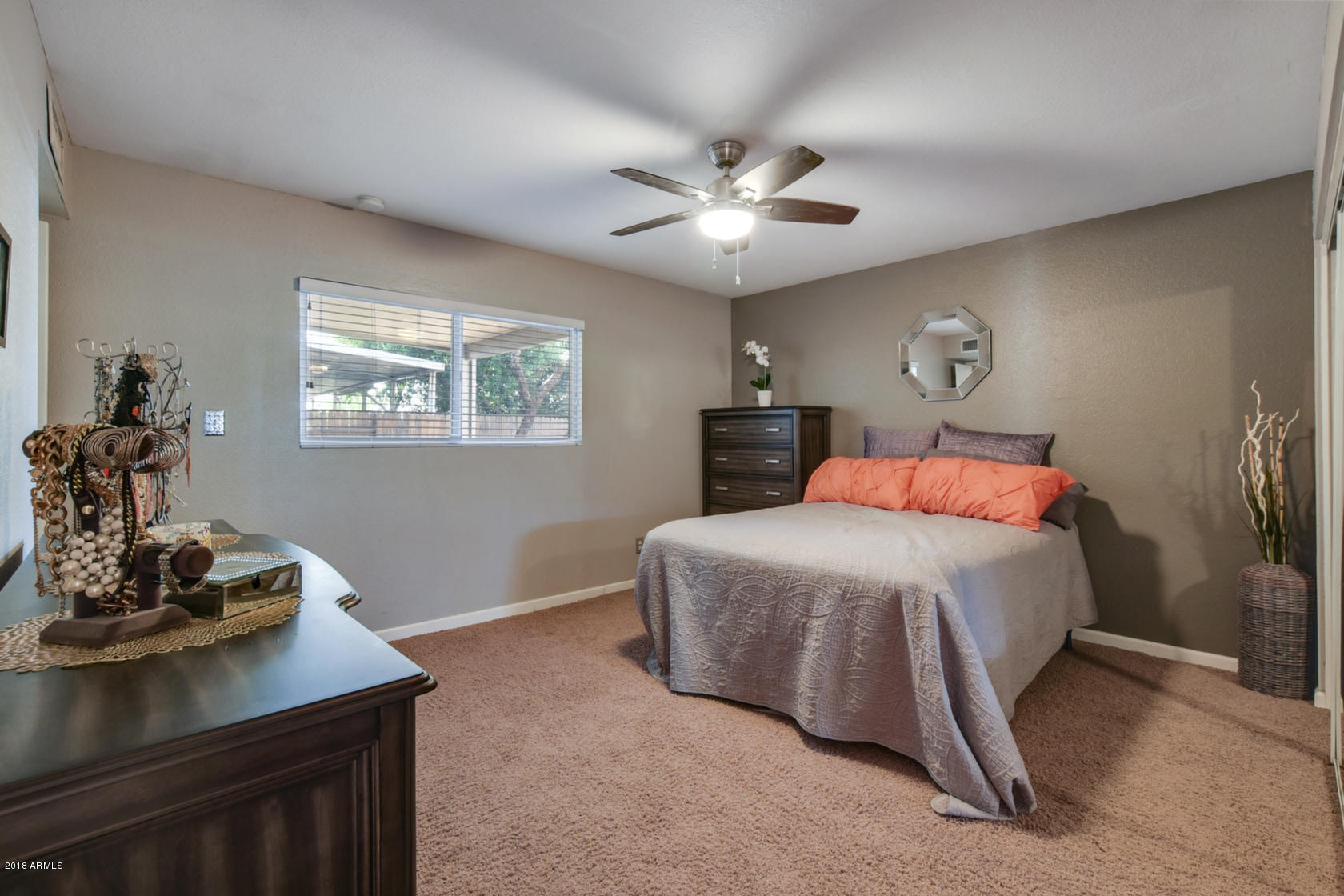 5910 North Granite Reef Road Scottsdale, AZ 85250 - Photo 18 of 33 a bedroom with a bed and a table