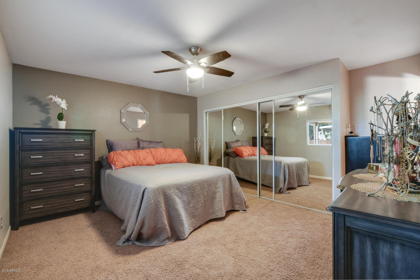 5910 North Granite Reef Road Scottsdale, AZ 85250 - Photo 19 of 33 a bedroom with a bed and a chandelier