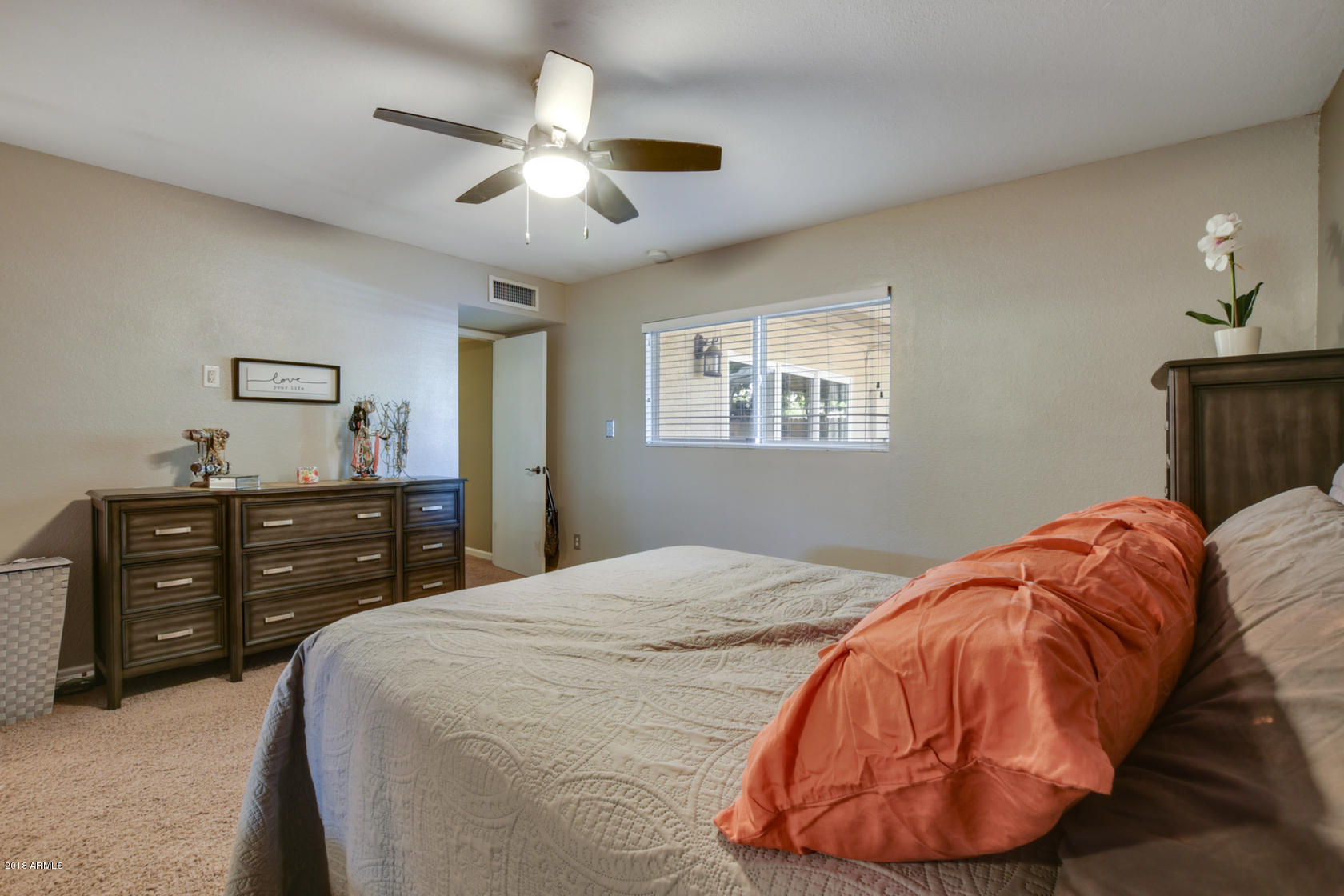 5910 North Granite Reef Road Scottsdale, AZ 85250 - Photo 20 of 33 a bed room with a bed and a dresser