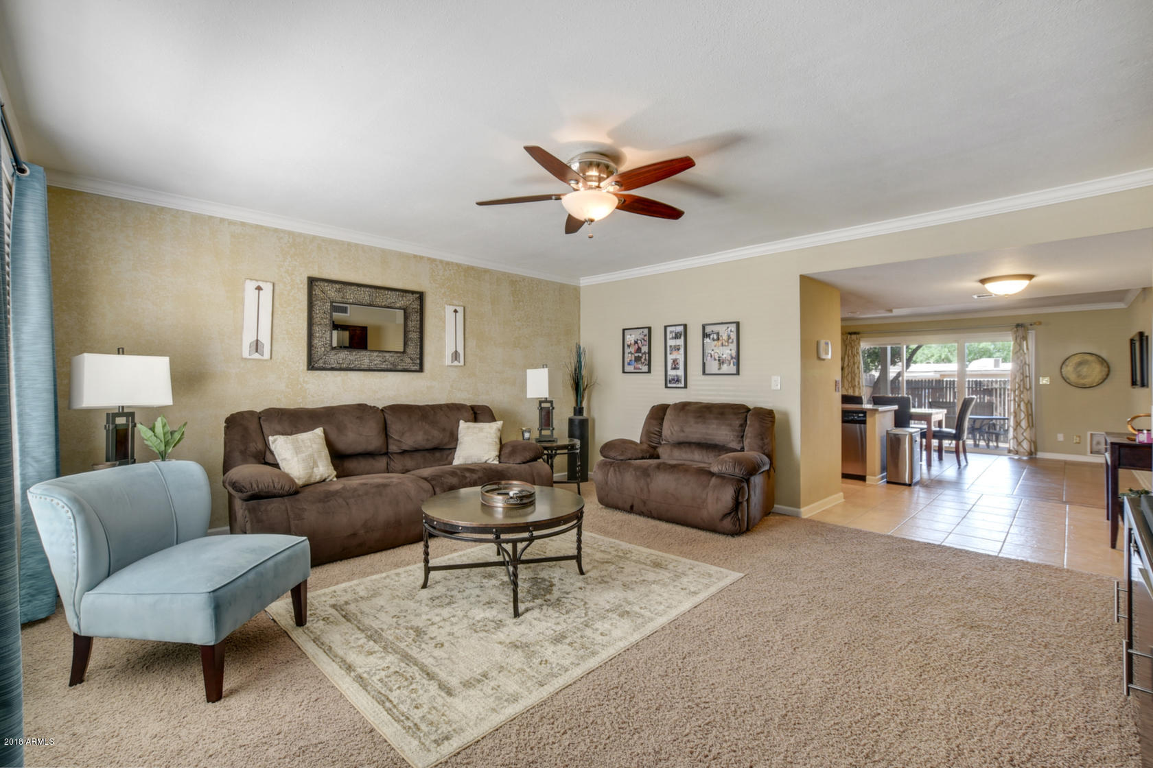 5910 North Granite Reef Road Scottsdale, AZ 85250 - Photo 2 of 33 a living room with furniture and a ceiling fan