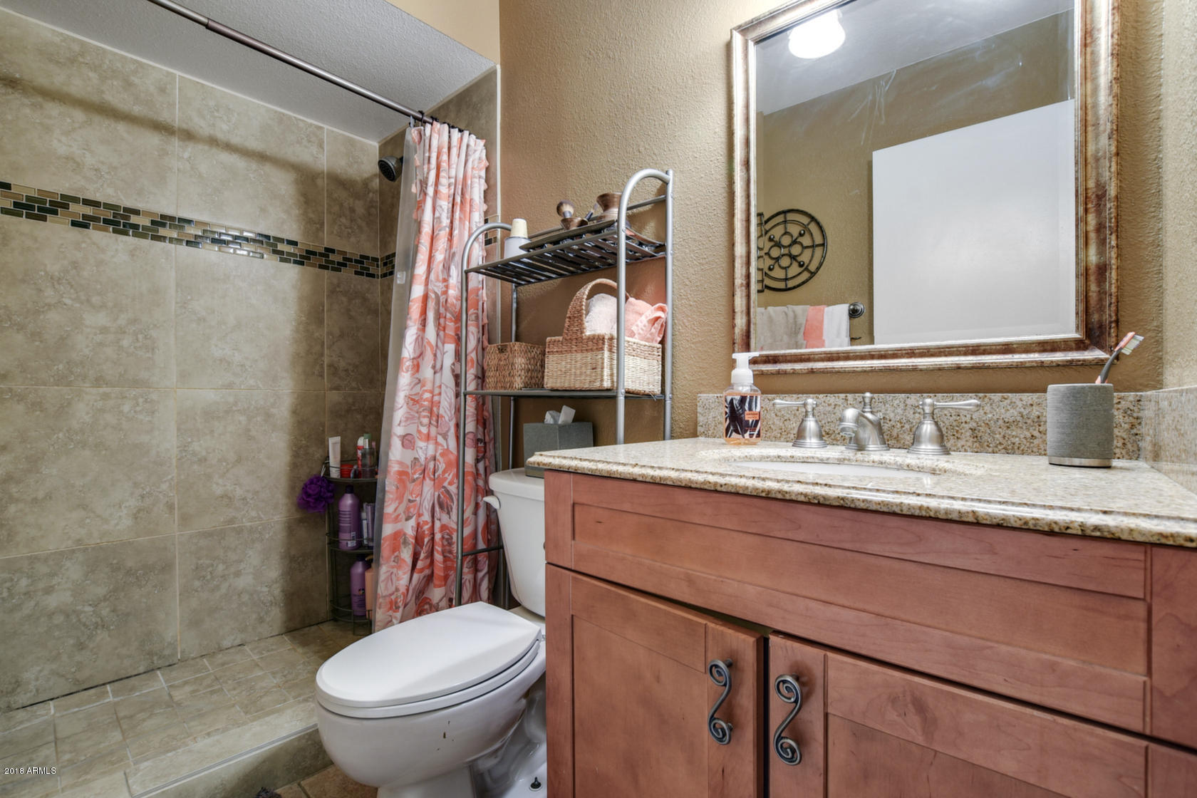 5910 North Granite Reef Road Scottsdale, AZ 85250 - Photo 21 of 33 a bathroom with a granite countertop sink toilet and shower
