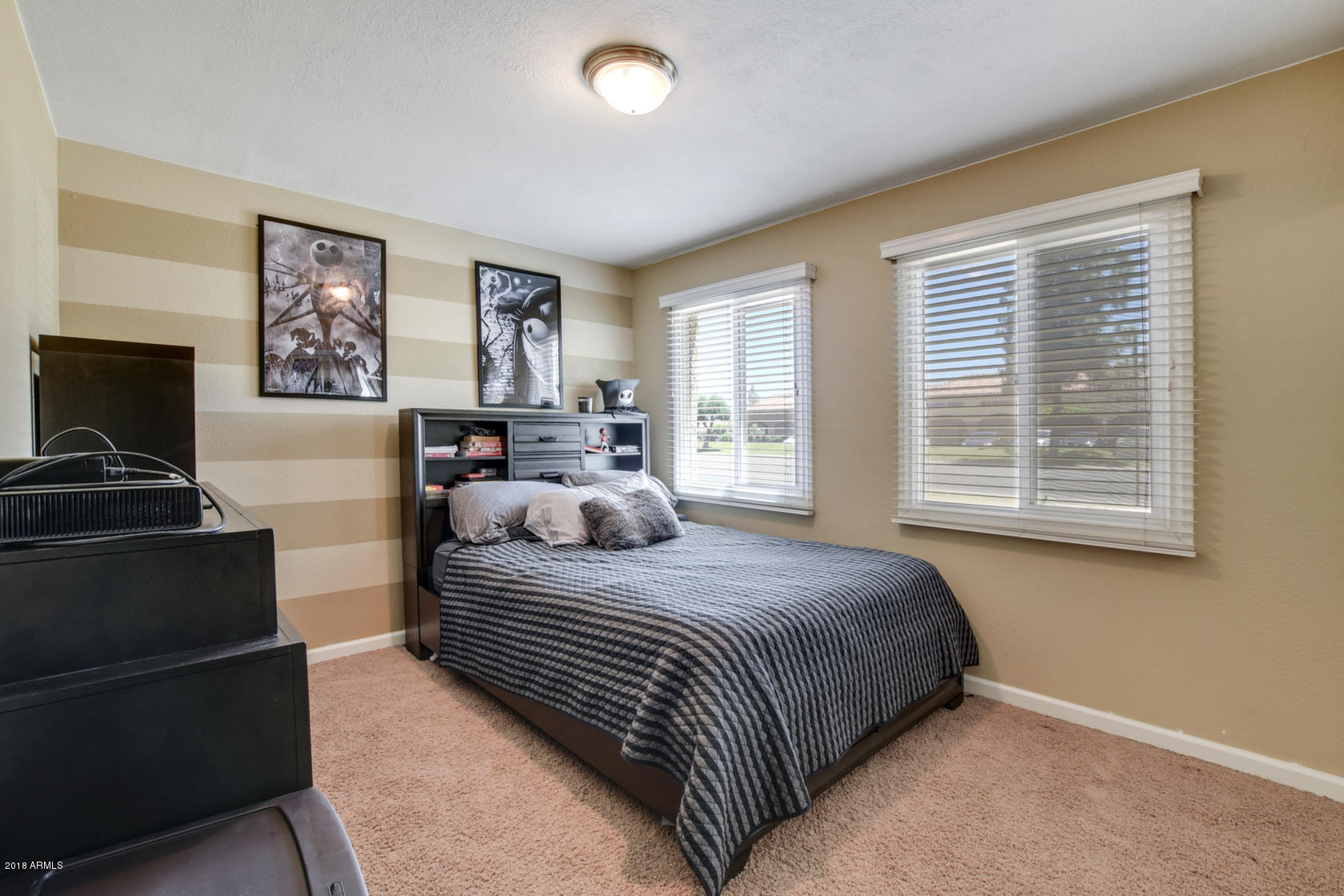 5910 North Granite Reef Road Scottsdale, AZ 85250 - Photo 22 of 33 a bedroom with a bed and a window