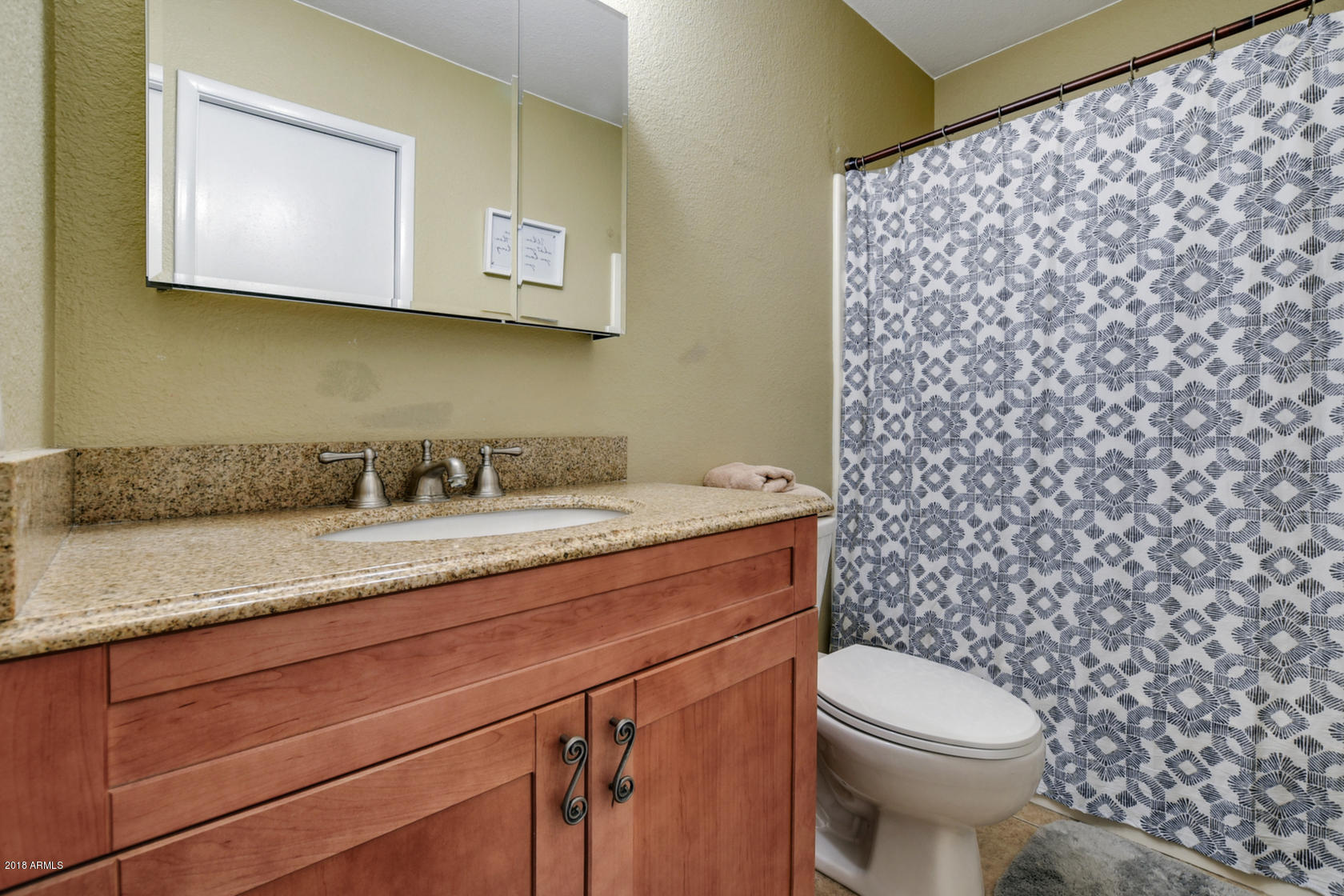 5910 North Granite Reef Road Scottsdale, AZ 85250 - Photo 24 of 33 a bathroom with a granite countertop sink toilet and mirror