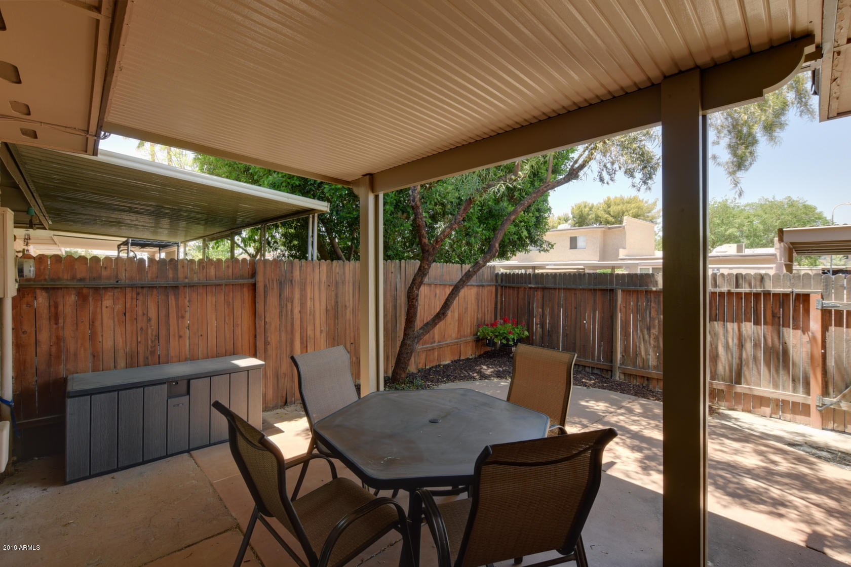 5910 North Granite Reef Road Scottsdale, AZ 85250 - Photo 26 of 33 a view of a patio with a table chairs and a grill
