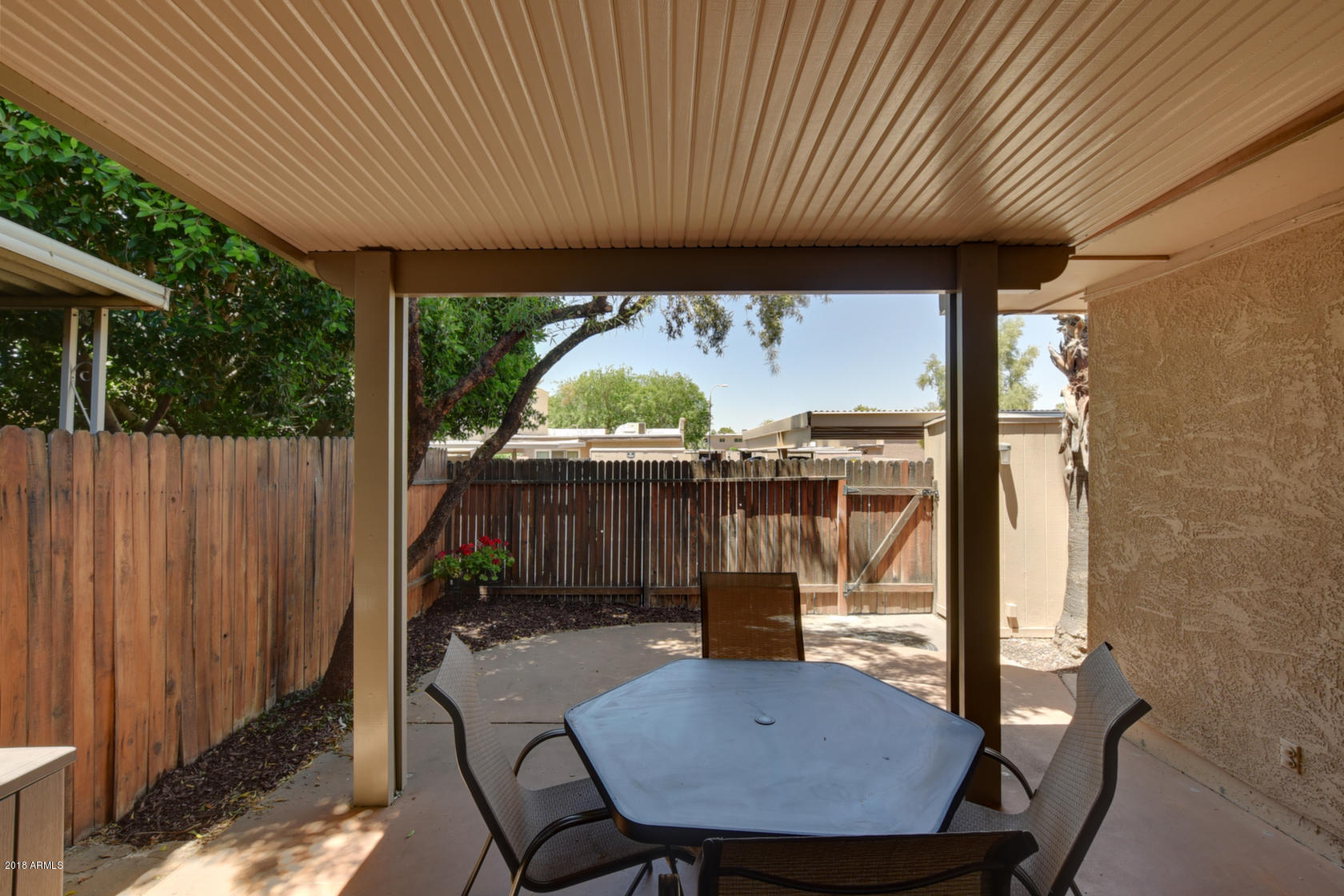 5910 North Granite Reef Road Scottsdale, AZ 85250 - Photo 28 of 33 a view of balcony with a table and chairs