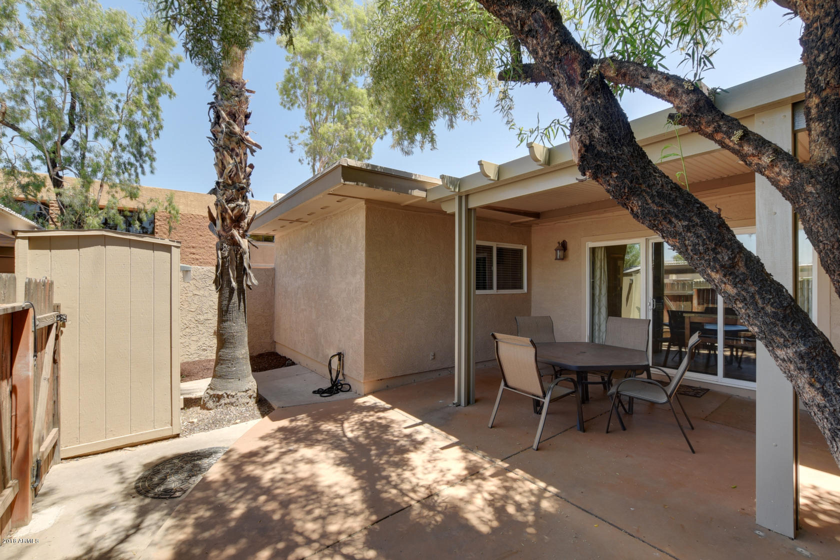 5910 North Granite Reef Road Scottsdale, AZ 85250 - Photo 29 of 33 a backyard of a house with table and chairs