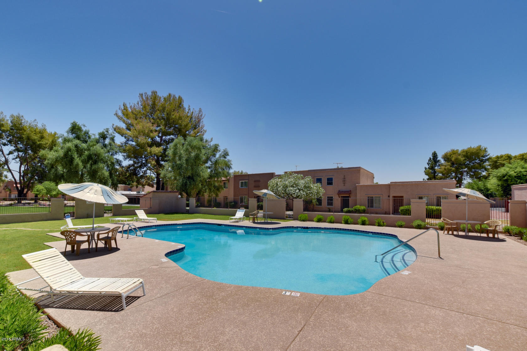 5910 North Granite Reef Road Scottsdale, AZ 85250 - Photo 31 of 33 a view of a swimming pool with lounge chair