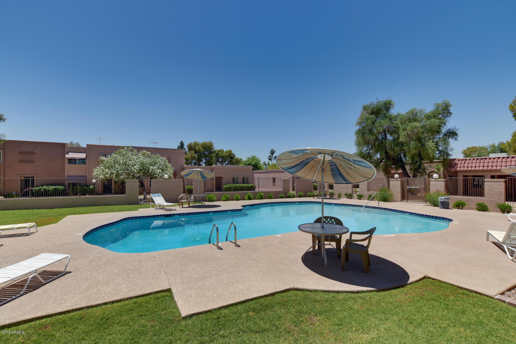 5910 North Granite Reef Road Scottsdale, AZ 85250 - Photo 7 of 33 a view of a backyard with sitting area and swimming pool
