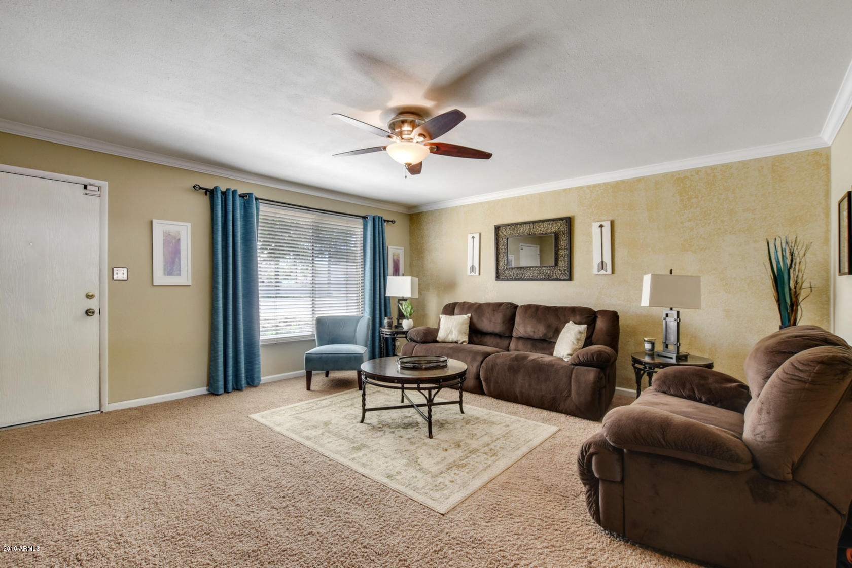 5910 North Granite Reef Road Scottsdale, AZ 85250 - Photo 8 of 33 a living room with furniture and a large window