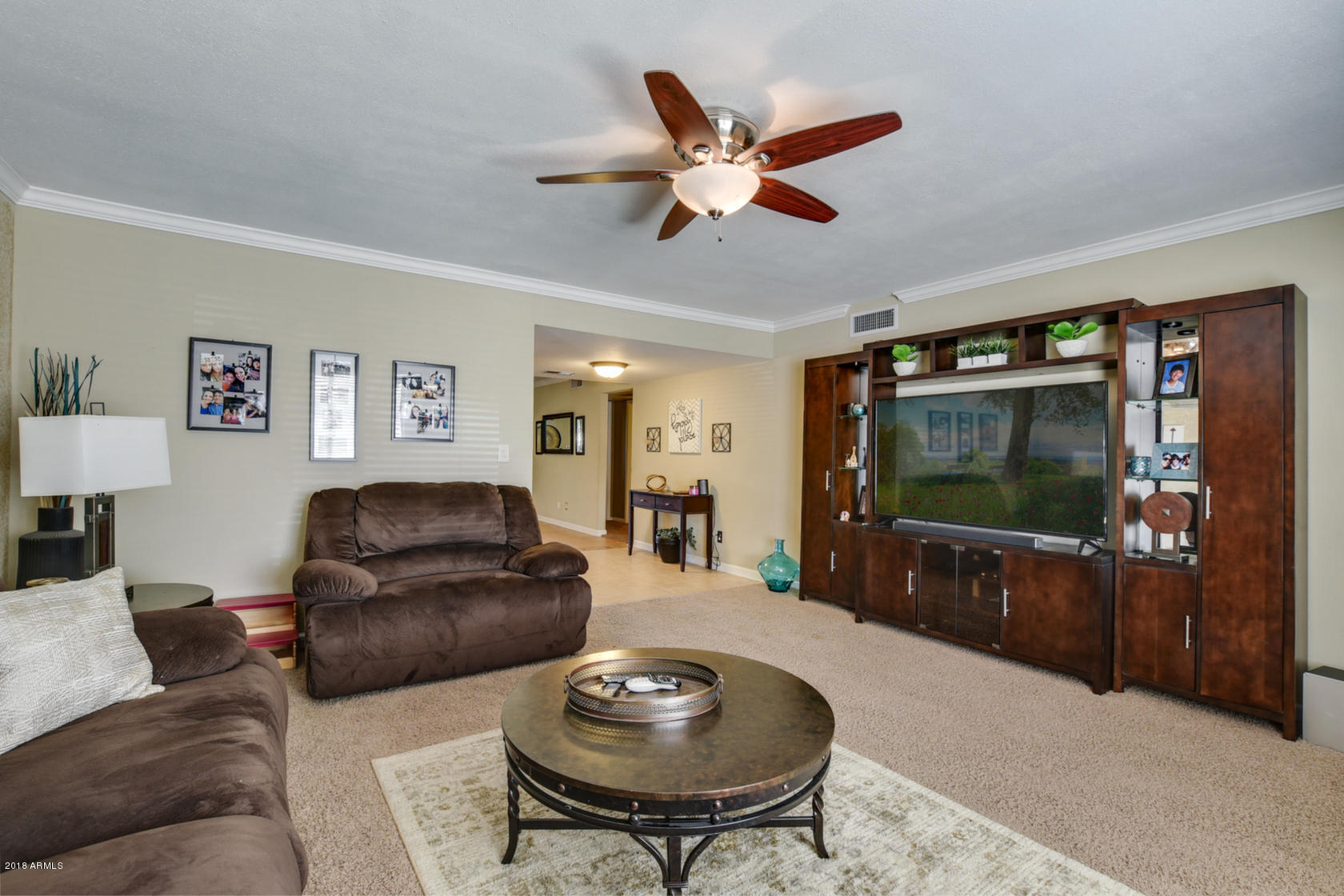 5910 North Granite Reef Road Scottsdale, AZ 85250 - Photo 9 of 33 a living room with furniture and a flat screen tv