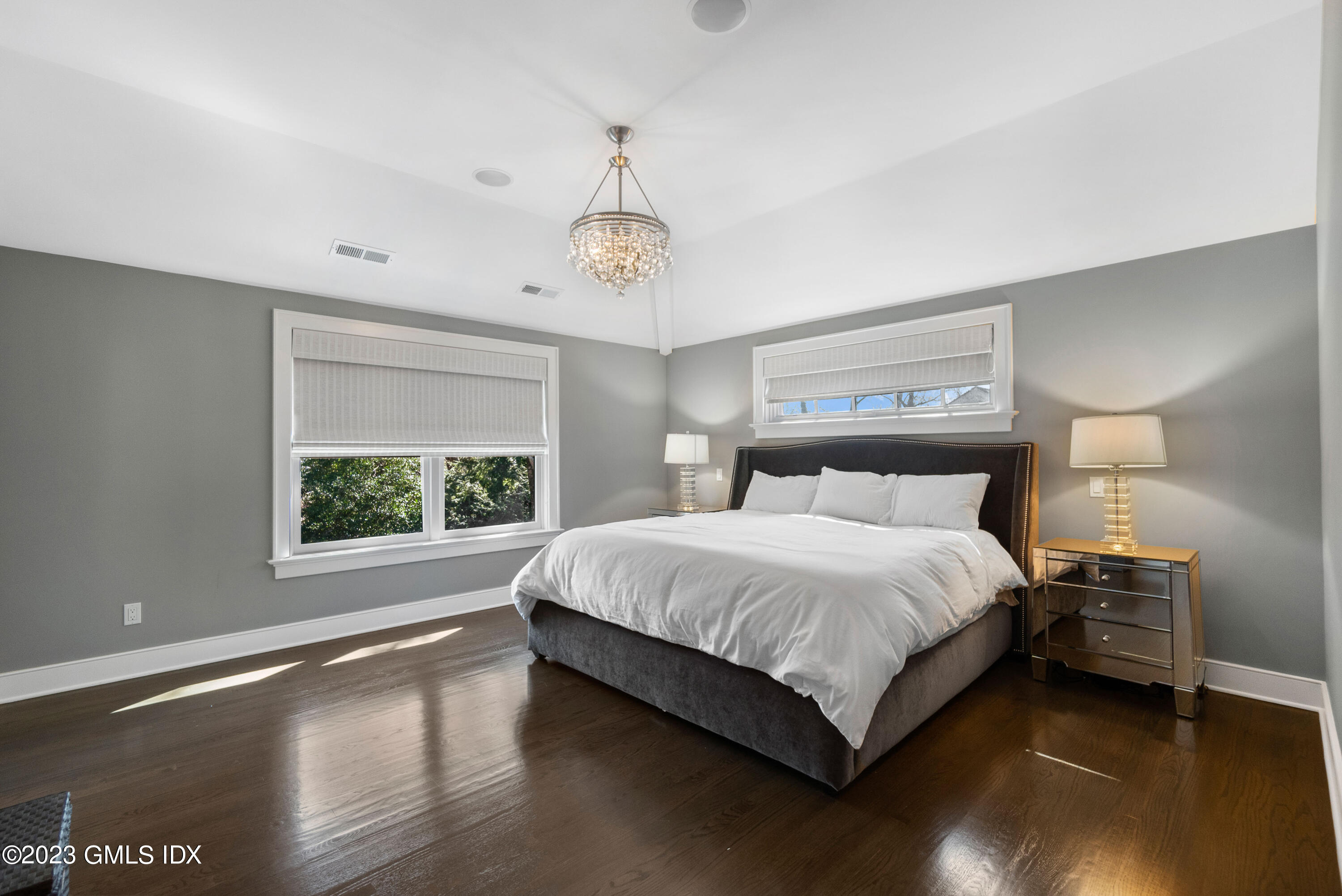 11 Colonial Lane Riverside, CT 06878 - Photo 17 of 37 a large bed sitting in a bedroom next to a window