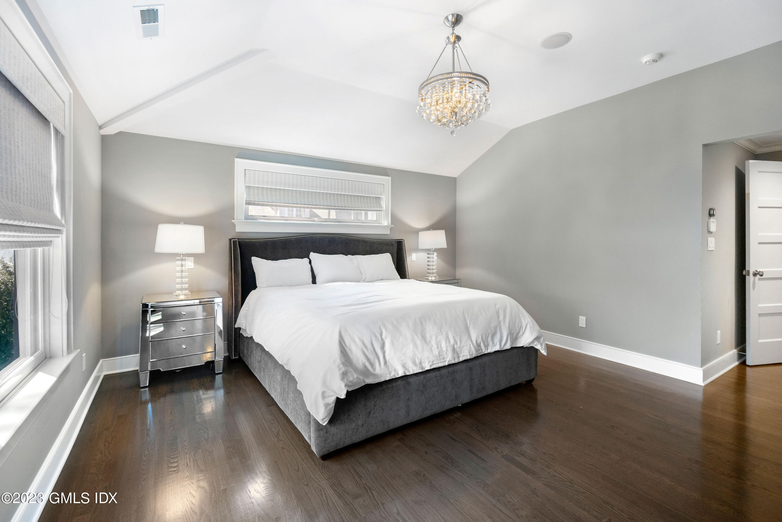 11 Colonial Lane Riverside, CT 06878 - Photo 18 of 37 a bedroom with a bed and wooden floor
