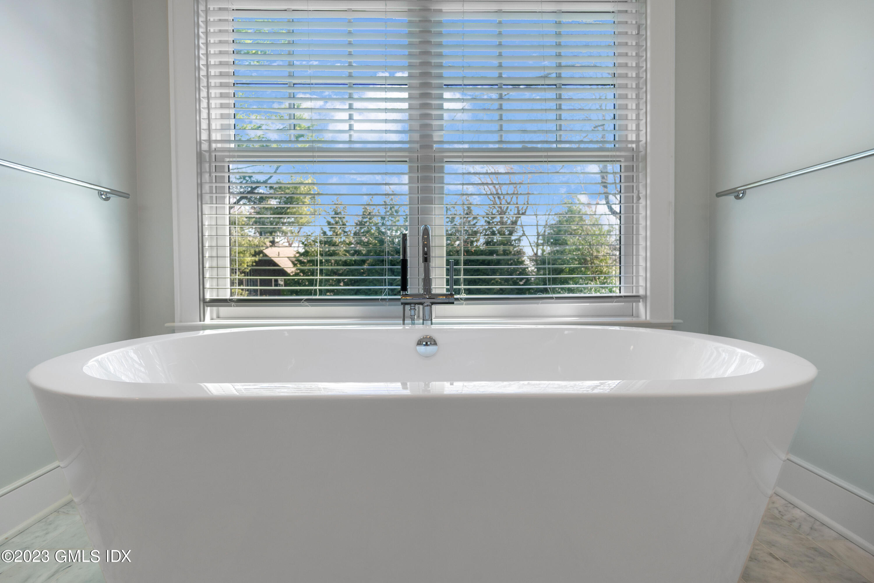 11 Colonial Lane Riverside, CT 06878 - Photo 20 of 37 a white bath tub sitting in front of a window