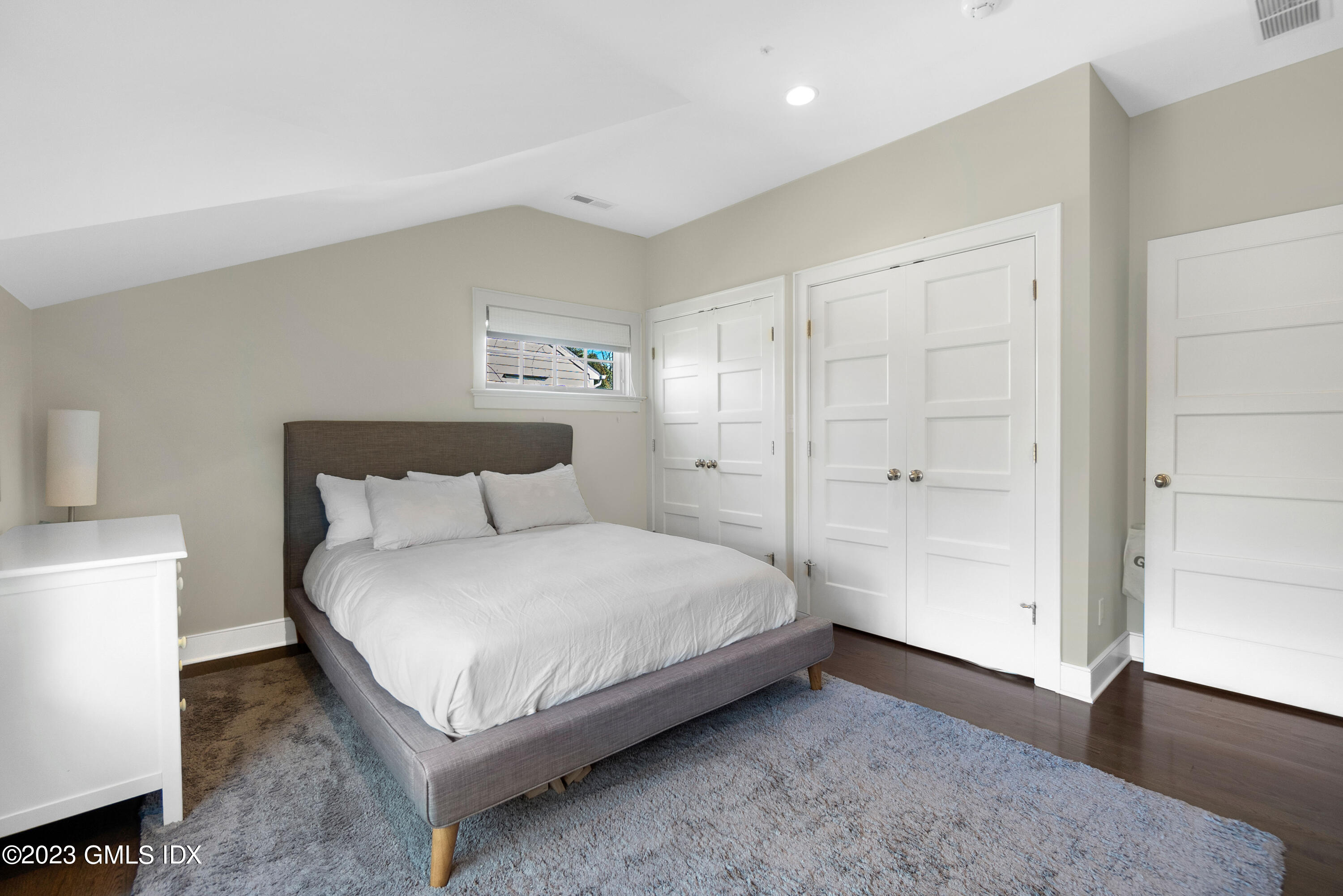 11 Colonial Lane Riverside, CT 06878 - Photo 22 of 37 a bedroom with a bed and a table