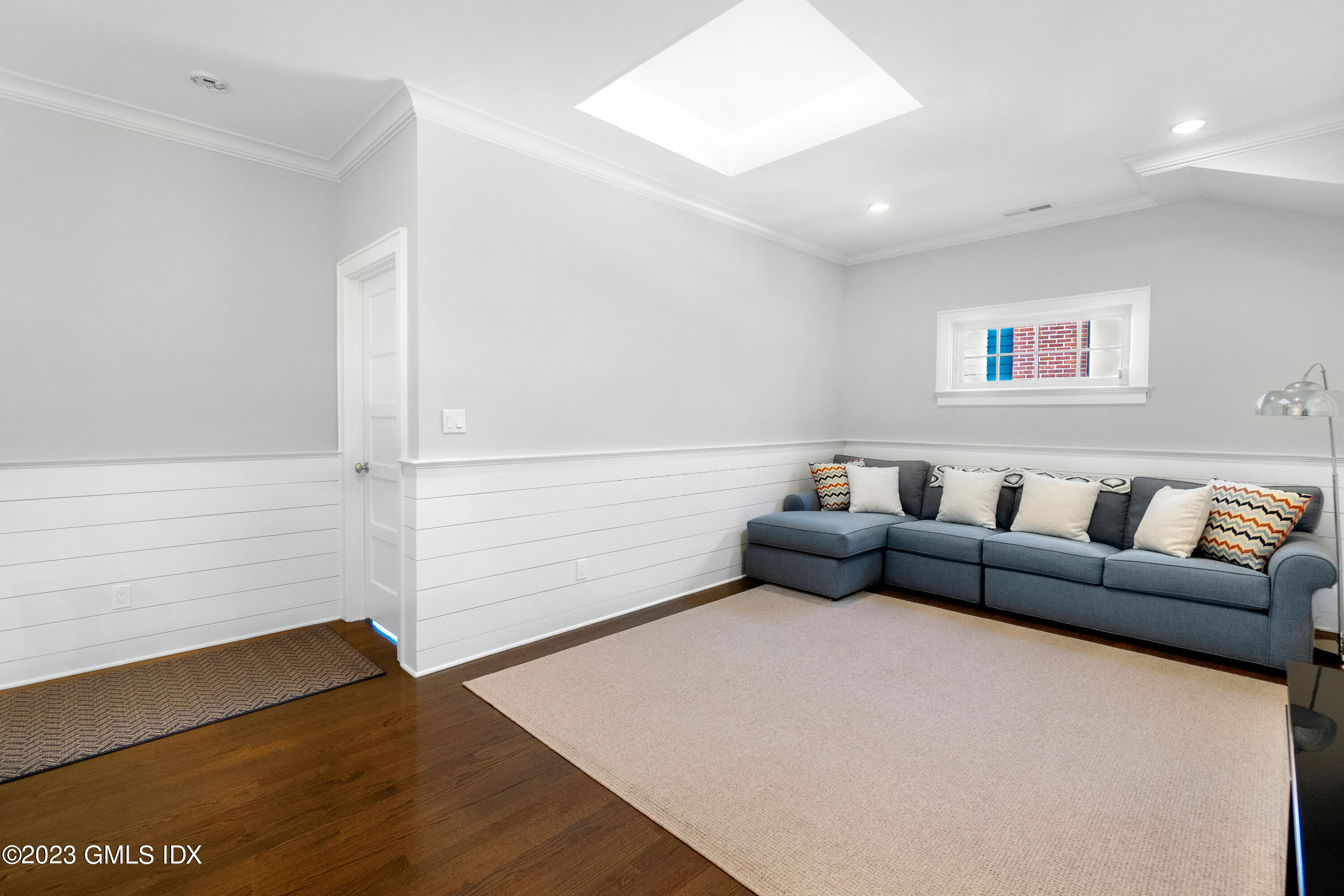 11 Colonial Lane Riverside, CT 06878 - Photo 25 of 37 a living room with furniture and a wooden floor