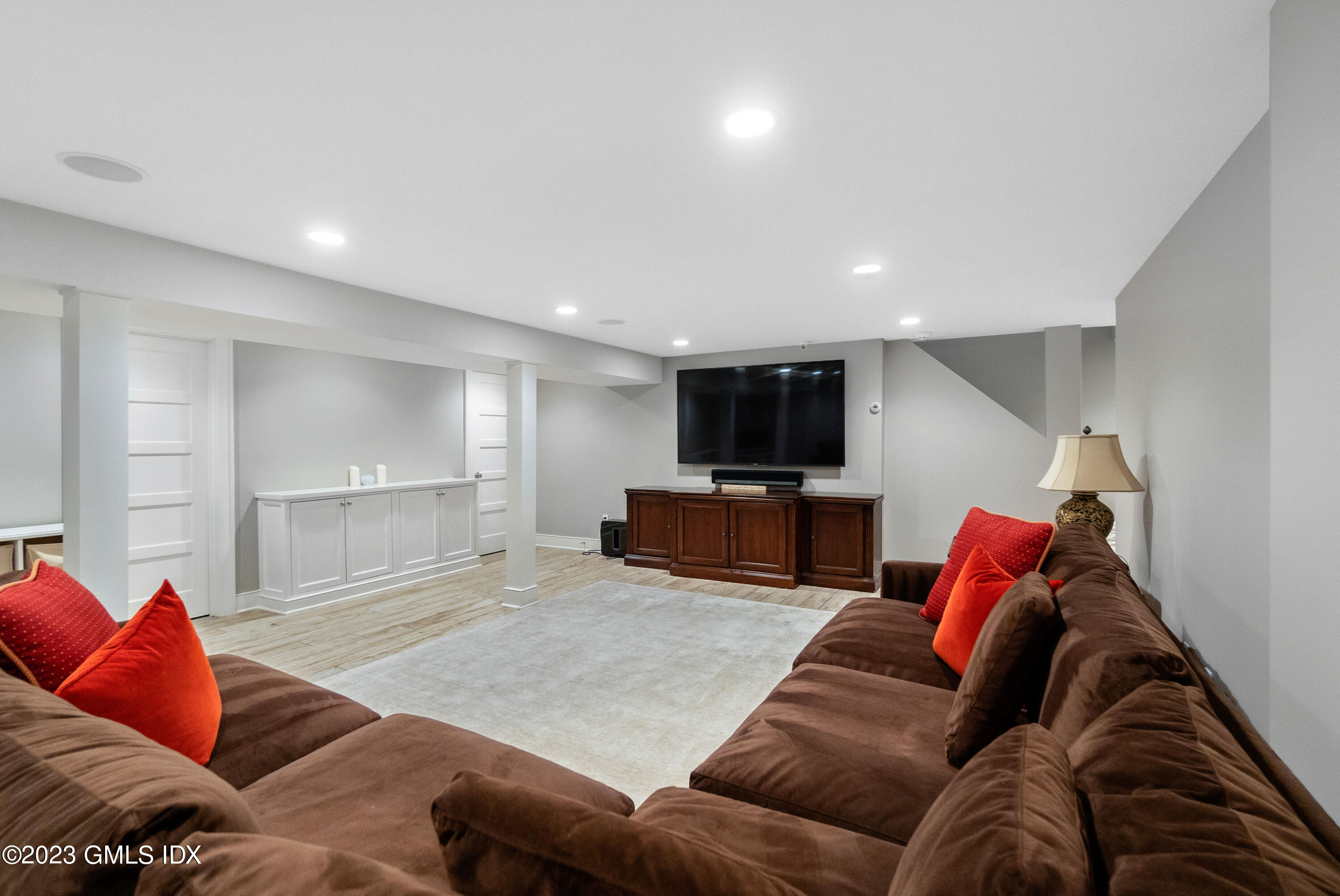 11 Colonial Lane Riverside, CT 06878 - Photo 27 of 37 a living room with furniture and a flat screen tv