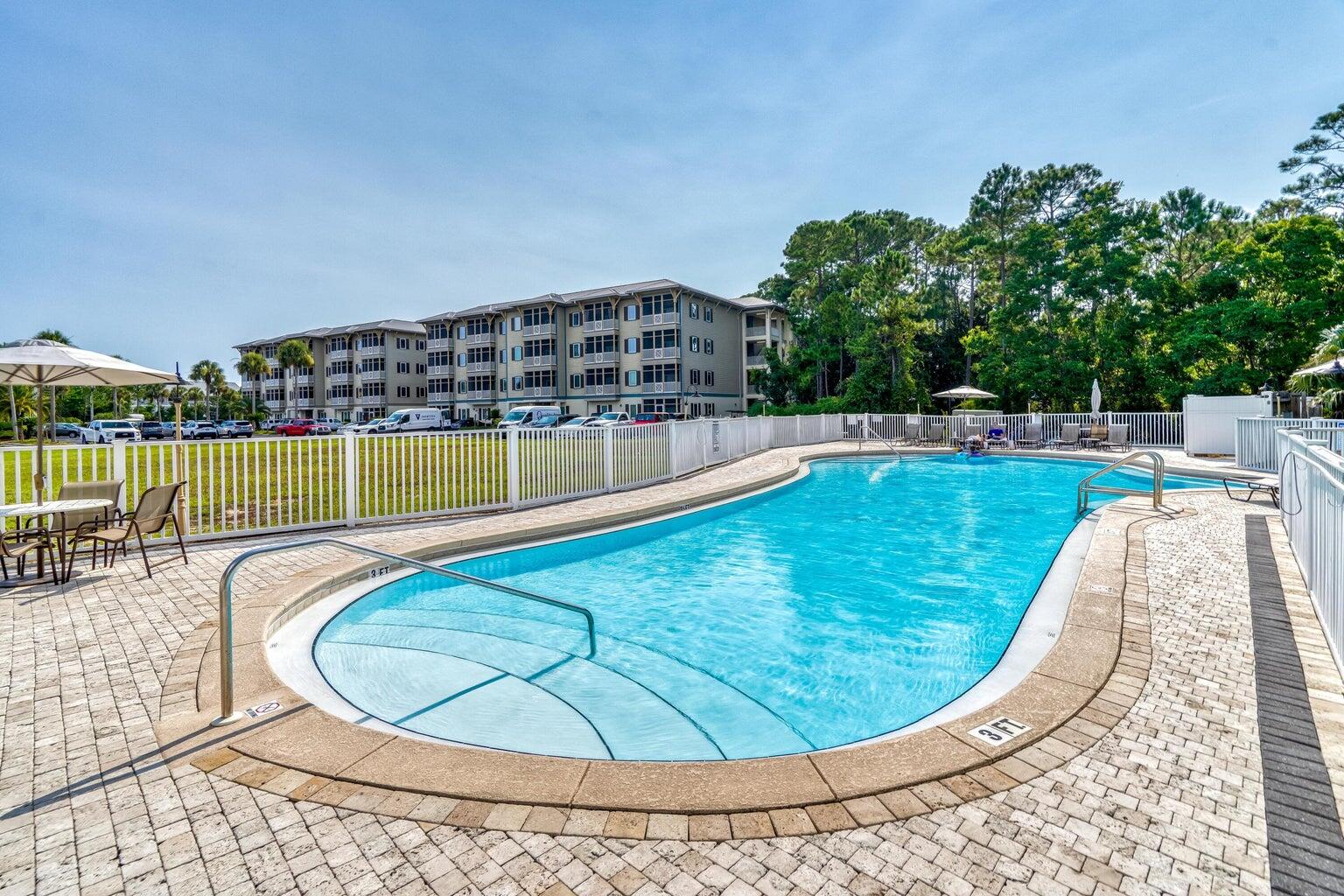 231 Somerset Bridge Road, Unit 2105 Santa Rosa Beach, FL 32459 - Photo 16 of 27 a view of a swimming pool with a chairs