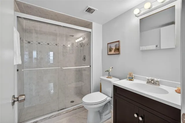 a view of a dining room with furniture and a window