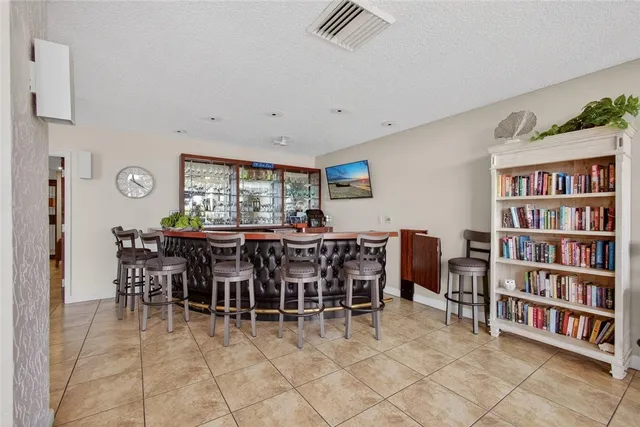 a view of a patio with a table and chairs