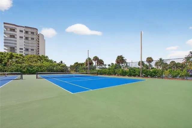 a view of a golf course with a swimming pool