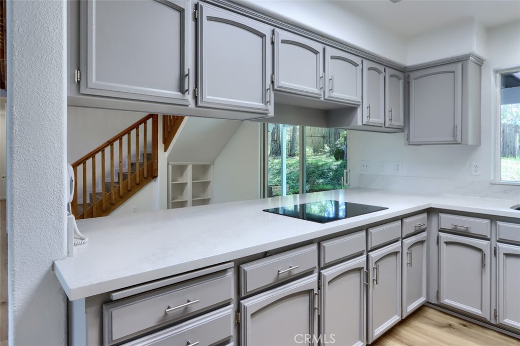 7174 Hites Cove Road Mariposa, CA 95338 - Photo 27 of 62 a kitchen with cabinets and window