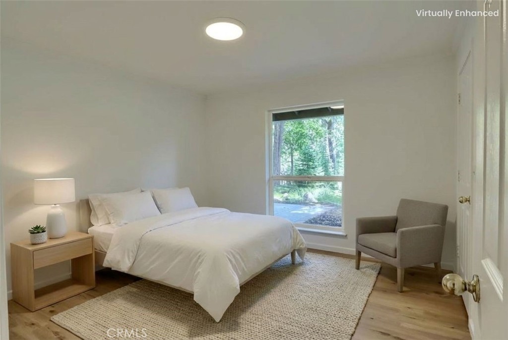 7174 Hites Cove Road Mariposa, CA 95338 - Photo 31 of 62 a bedroom with a bed and a window