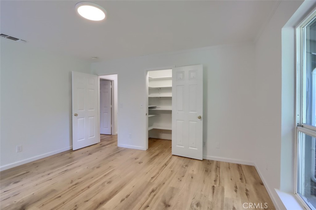 7174 Hites Cove Road Mariposa, CA 95338 - Photo 38 of 62 a view of wooden floor and windows in a room
