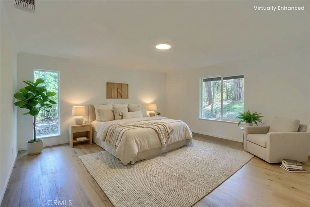 7174 Hites Cove Road Mariposa, CA 95338 - Photo 39 of 62 a spacious bedroom with a bed and a couch