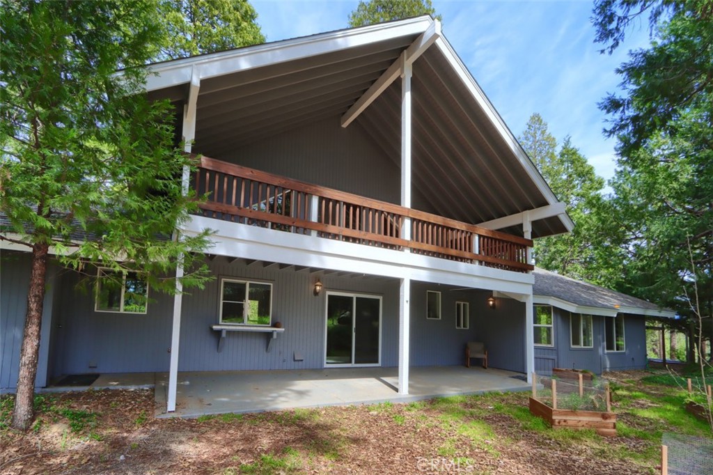 7174 Hites Cove Road Mariposa, CA 95338 - Photo 47 of 62 a backyard of a house with plants and large tree
