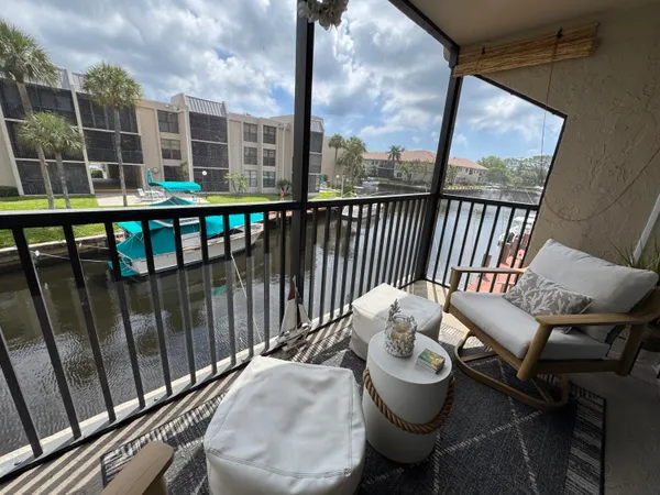 a view of a balcony with a patio
