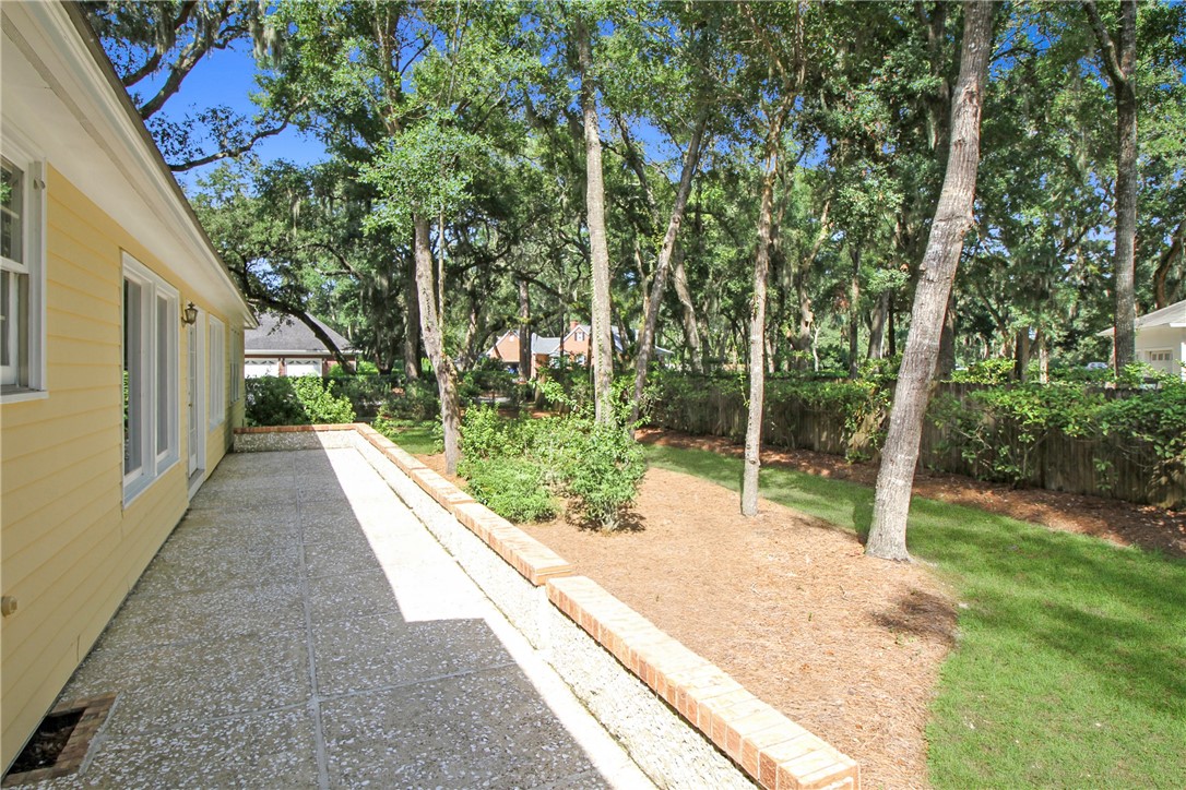 201 Five Pounds Road St. Simons Island, GA 31522 - Photo 34 of 37 Tabby paved patio extends the length of the house
