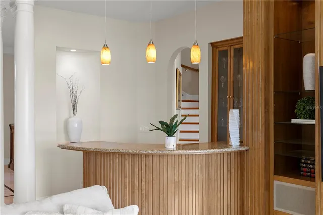 a living room with furniture toys and a book shelf