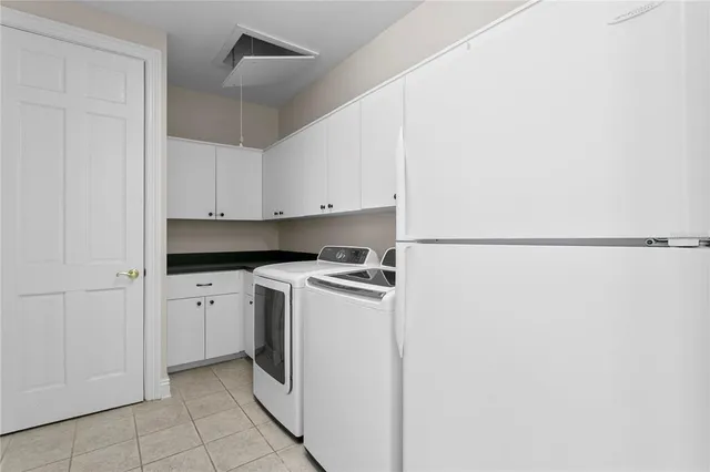 a front view of a house with a yard and tree s