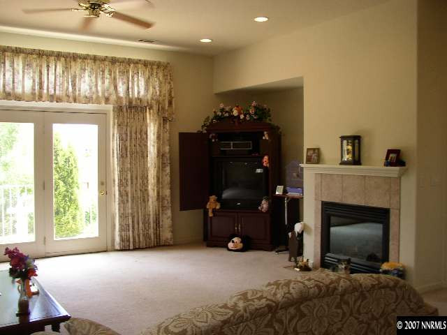 487 Sierra Leaf Circle Reno, NV 89511 - Photo 2 of 9 a living room with furniture and a fireplace