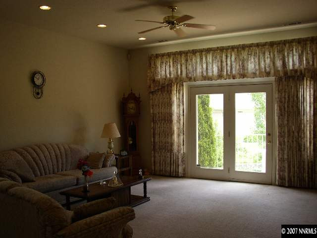 487 Sierra Leaf Circle Reno, NV 89511 - Photo 3 of 9 a living room with furniture and a fireplace