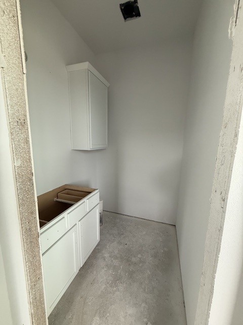 127 Riparian Elms Road Bertram, TX 78605 - Photo 9 of 22 A well-proportioned utility room with a compact layout and ready-to-finish cabinetry.