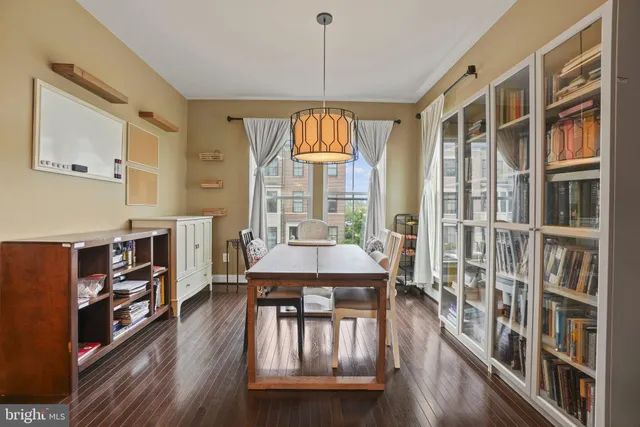 a view of a livingroom with furniture window and wooden floor