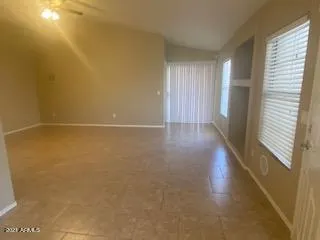 an empty room with a empty space and a window